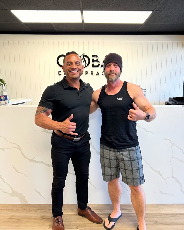 Dr. Steve and a patient at the front desk
